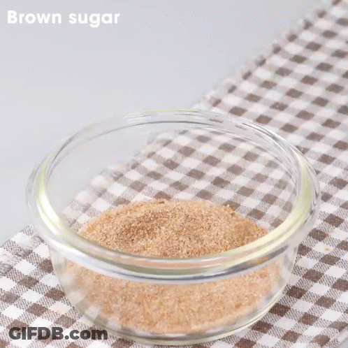 Glass Bowl With Brown Sugar And Peanut Butter And Tongs GIF