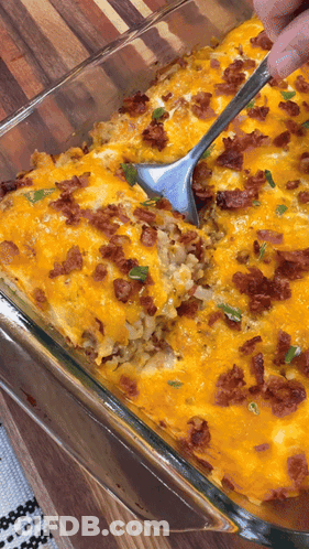 Glass Casserole Dish With Rice, Cheese, Bacon And Spoon GIF