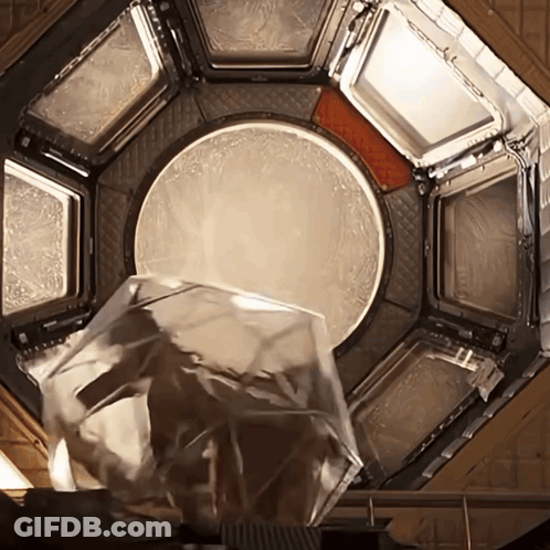 Glass Container Poured Into Circular Hole GIF