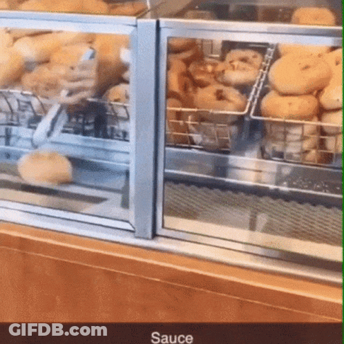 Glass Display Case Filled With Donuts Saying Sauce GIF