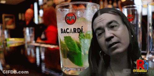 Glass Of Bacardi Next To Woman's Face GIF