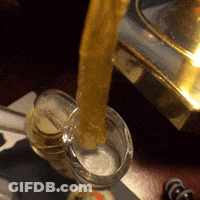 Glass Of Liquid Being Poured Into Another Glass GIF