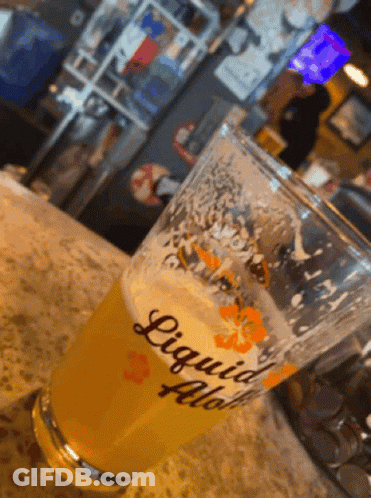 Glass Of Liquid Flow On Counter GIF
