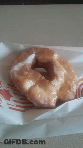 Glazed Donut Wrapped In Red And White Striped Paper GIF