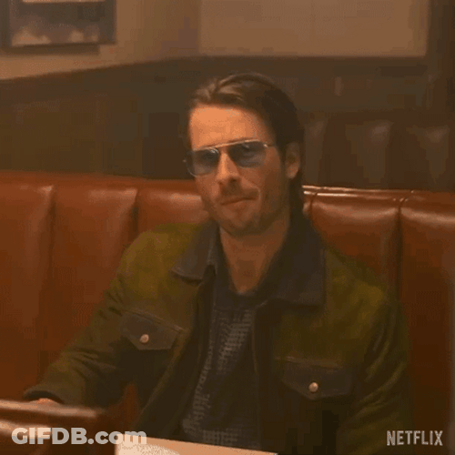 Glen Powell Cocky Wearing Dark Glasses GIF