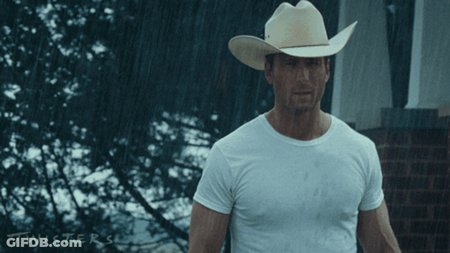 Glen Powell Walking Under The Rain GIF