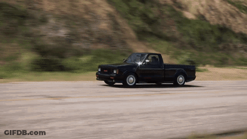 GMC Truck Driving Down Road GIF