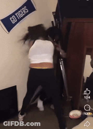 Go Tigers Banner Next To Woman GIF