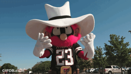 Goat Wearing Party Hat In Front Of Birthday Cake GIF