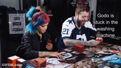 Godo Is Stuck In The Washing Machine With A Man And Woman Playing A Board Game GIF