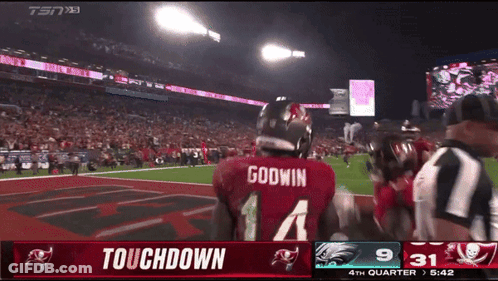 Godwin Football Player On Field During Touchdown GIF