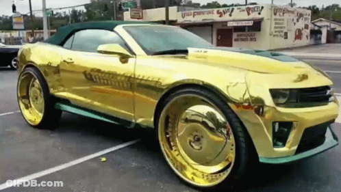 Gold Convertible Parked In Parking Lot GIF