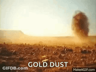 Gold Dust Explosion In Desert GIF