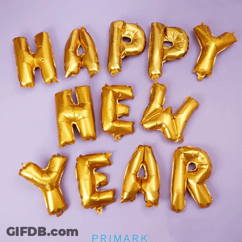Gold Foil Balloons Spell Out Happy New Year GIF