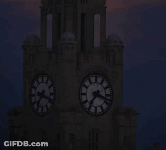 Gold Super Moon Behind Clock Tower GIF
