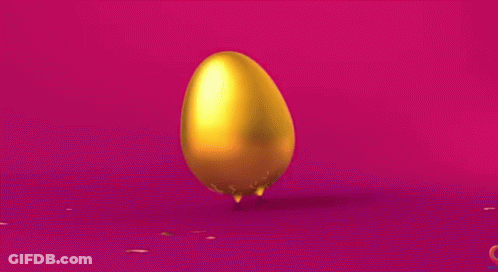 Golden Egg With Confetti On Pink Surface GIF