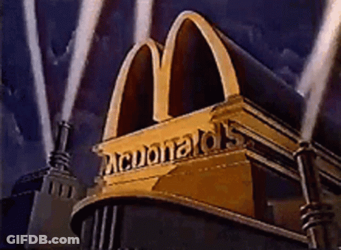 Golden McDonald's Sign Lit Up In Dark GIF