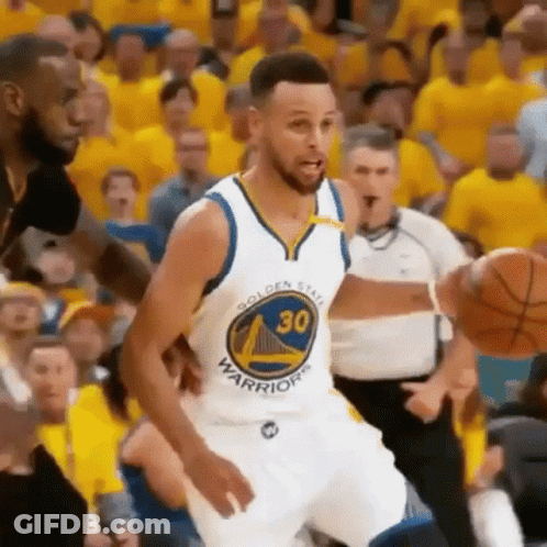 Golden State Warriors Basketball Player Stephen Curry Is Dribbling A Basketball During A Basketball Game . GIF