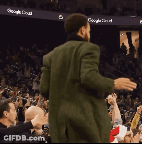 Golden State Warriors Basketball Player Stephen Curry Stands In Front Of A Logo For The Golden State Warriors GIF