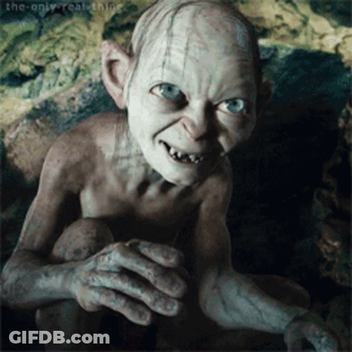 Gollum From The Lord Of The Rings Is Looking At The Camera GIF
