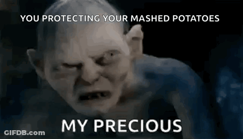 Gollum From The Lord Of The Rings Is Making A Funny Face And Says `` You Protecting Your Mashed Potatoes '' . GIF