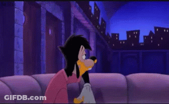 Goofy Cartoon Character Sitting On Couch With City Background GIF