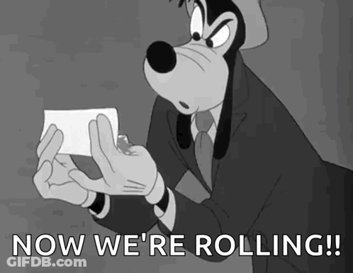 Goofy Holding Paper Saying Now We're Rolling GIF
