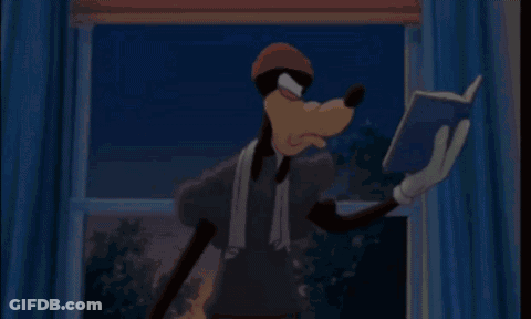 Goofy Is Reading A Book In Front Of A Window While Wearing A Towel Around His Neck . GIF