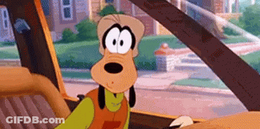 Goofy Is Sitting In The Back Seat Of A Car . GIF