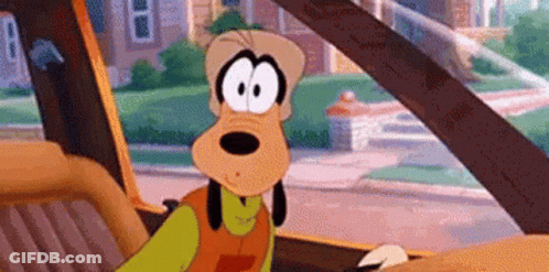 Goofy Is Sitting In The Back Seat Of A Car . GIF