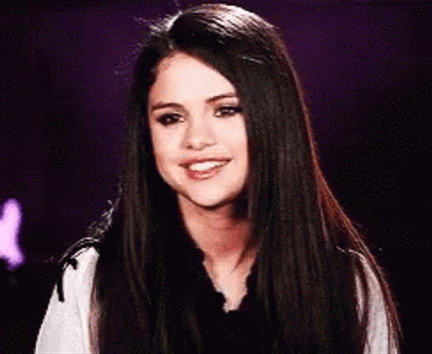 Gorgeous Selena Gomez Demure Giggle GIF