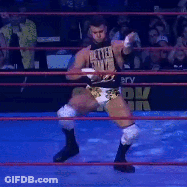 Gorilla In Front Of Building With Ropes GIF