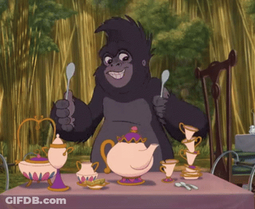 Gorilla Sitting At Table With Teapots And Cups GIF