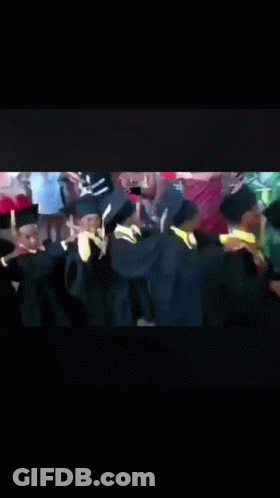 Graduates Dancing In Caps And Gowns GIF