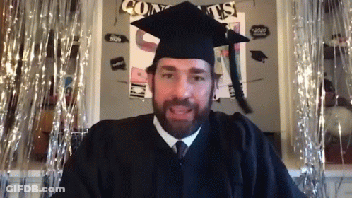 Graduation Man Sitting In Front Of Congrats Sign GIF