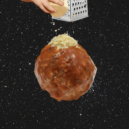 Grating Cheese Over A Meatball GIF