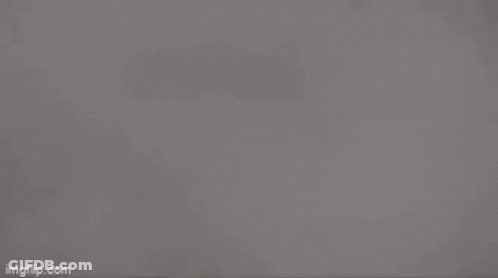 Gray Background With Triangles And Light GIF