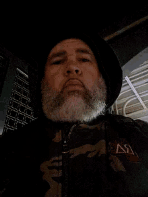 Gray Bearded Guy Wearing Hoodie Flipping Off GIF