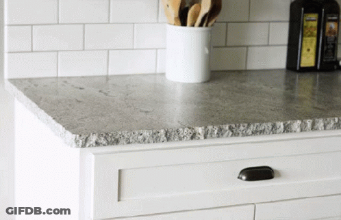 Gray Granite Countertop With White Cabinet GIF