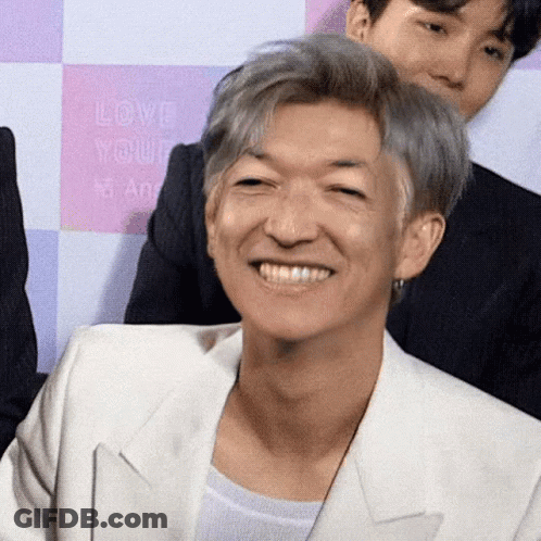 Gray Hair Man In White Jacket Smiling At Love Yourself Sign GIF