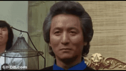 Gray Haired Man In Blue Shirt With Bird Cage GIF