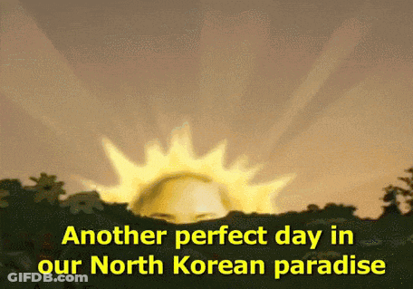Gray-Haired Man In White Jacket Smiling At Love Yourself Sign GIF