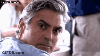 Gray-Haired Man Looking Over Shoulder On Plane GIF