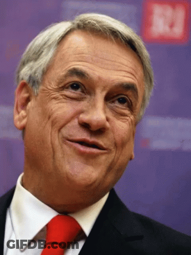Gray-Haired Man Red Tie Smiling Purple Wall N GIF