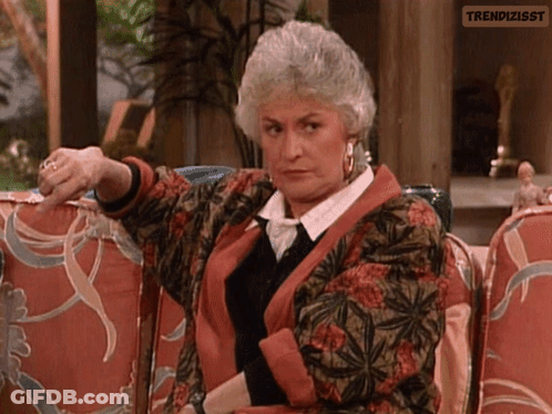 Gray-Haired Woman Pointing At Camera GIF