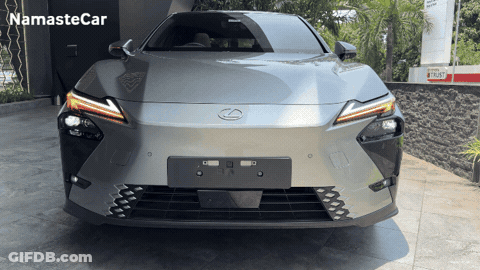 Gray Lexus Parked In Front Of Namaste Car Building GIF