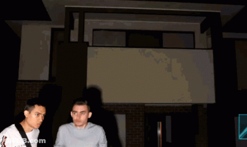 Gray Shirt Man Beside Blue Shirt Man GIF