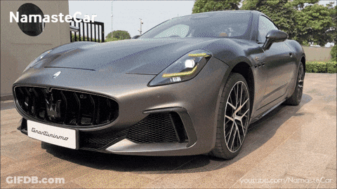 Gray Sports Car With Namaste Logo GIF