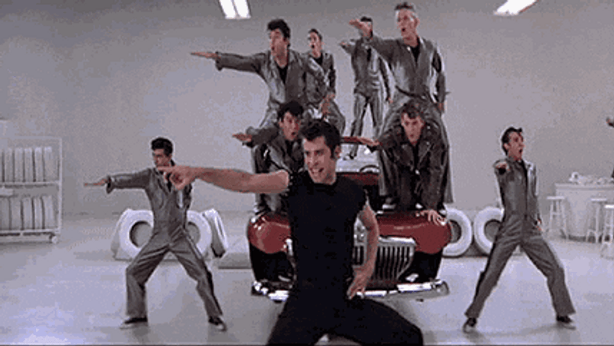Grease Pointing In Front GIF