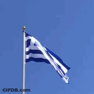 Greek Flag Flying In Wind Against Blue Sky GIF